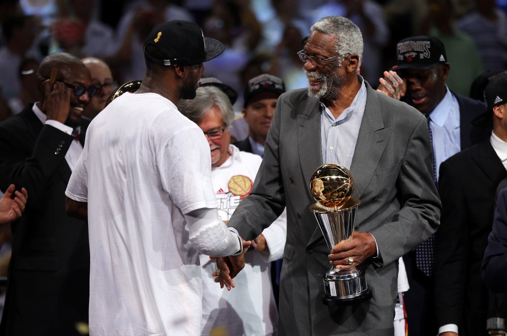 MIAMI, FL - JUNE 20:  LeBron James #6 of the Miami Heat shakes hands with Bill Russell after winning the Bill Russell NBA Finals Most Valuable Player Award after defeating the San Antonio Spurs 95-88 to win Game Seven of the 2013 NBA Finals at AmericanAirlines Arena on June 20, 2013 in Miami, Florida. NOTE TO USER: User expressly acknowledges and agrees that, by downloading and or using this photograph, User is consenting to the terms and conditions of the Getty Images License Agreement.  (Photo by Mike Ehrmann/Getty Images)