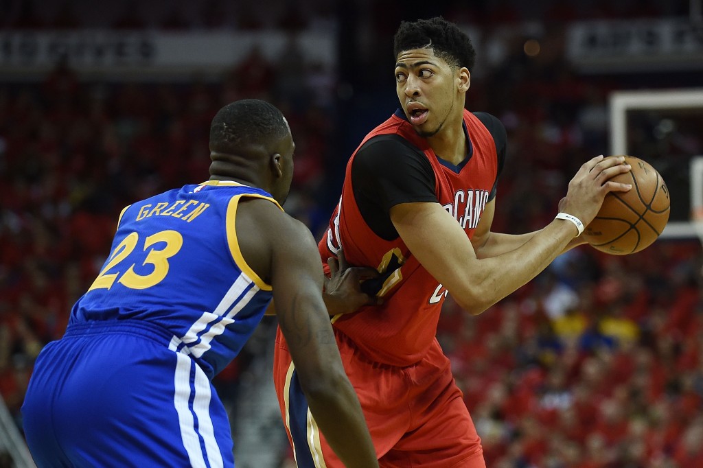 NEW ORLEANS, LA - APRIL 23:  Anthony Davis #23 of the New Orleans Pelicans works against Draymond Green #23 of the Golden State Warriors during the first half of Game Three in the first round of the 2015 NBA Playoffs at the Smoothie King Center on April 23, 2015 in New Orleans, Louisiana. NOTE TO USER: User expressly acknowledges and agrees that, by downloading and or using this photograph, User is consenting to the terms and conditions of the Getty Images License Agreement.  (Photo by Stacy Revere/Getty Images)