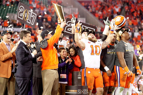 TAMPA, FL - JANUARY 09:  Head coach Dabo Swinney of the Clemson Tigers celebrates with the College Football Playoff National Championship Trophy after defeating the Alabama Crimson Tide 35-31 to win the 2017 College Football Playoff National Championship Game at Raymond James Stadium on January 9, 2017 in Tampa, Florida.  (Photo by Jamie Squire/Getty Images)